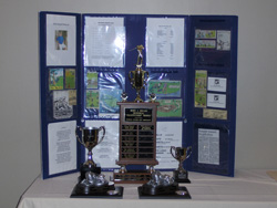 Pavlos Memorial and Brady Cup Trophies on Display at Registration Desk